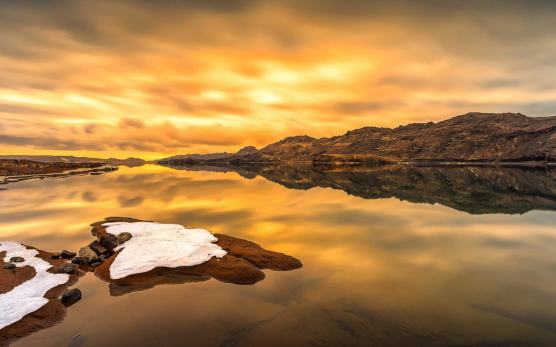 waterfront, nature, outdoors, snow, tranquility, cloud - sky, solid, calm waters, sea, sunset, water, mountain, idyllic, sky, rock, beauty in nature, landscape