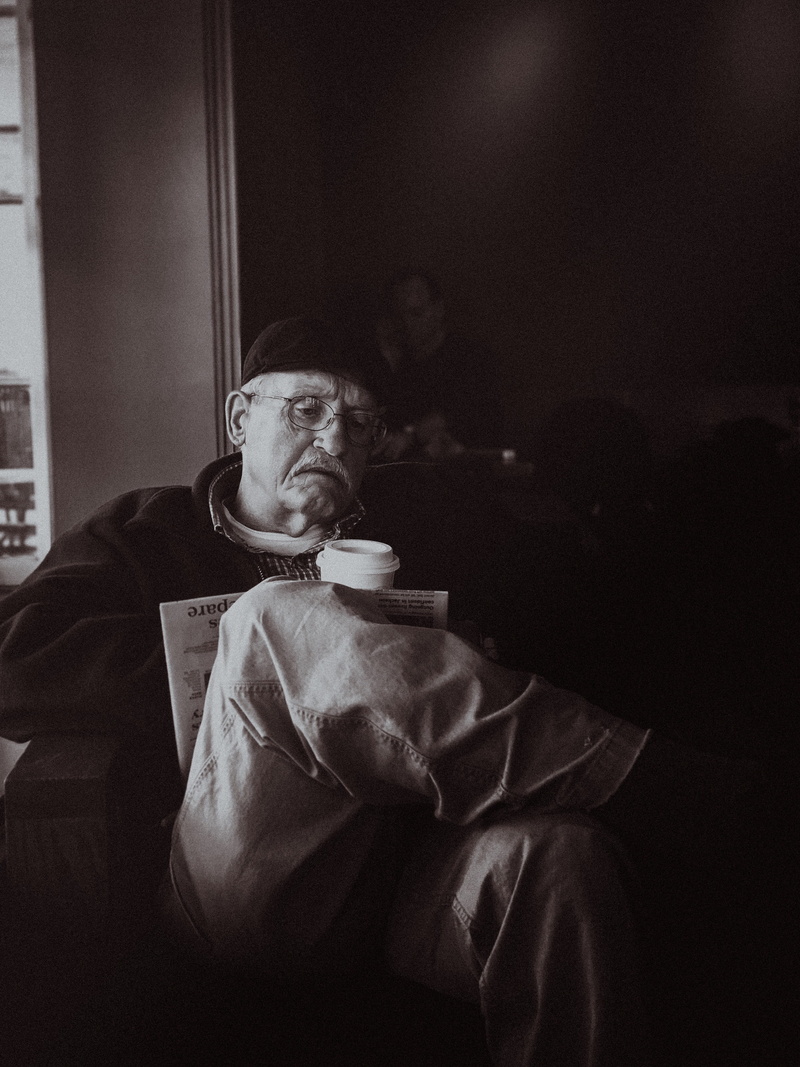 lifestyles, furniture, real people, contemplation, men, meal, photography, head, sitting, face, military, looking away, human, finger, food, indoors, one person