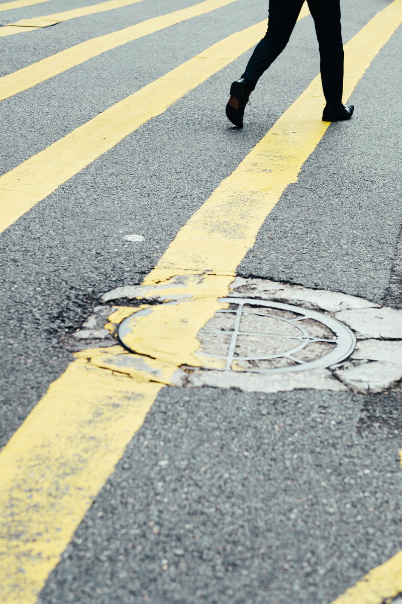 leg, feet, road, sign, walk, stripe, yellow, urban, art, symbol, manhole, walking, day, body part, 5K, surface level, outdoors, marking, crossing, human body part