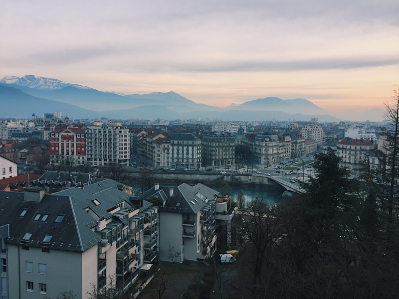 office building, outdoors, architecture, building, neighborhood, buildings, residential district, landscape, city, high angle view, tree, mountain, cityscape