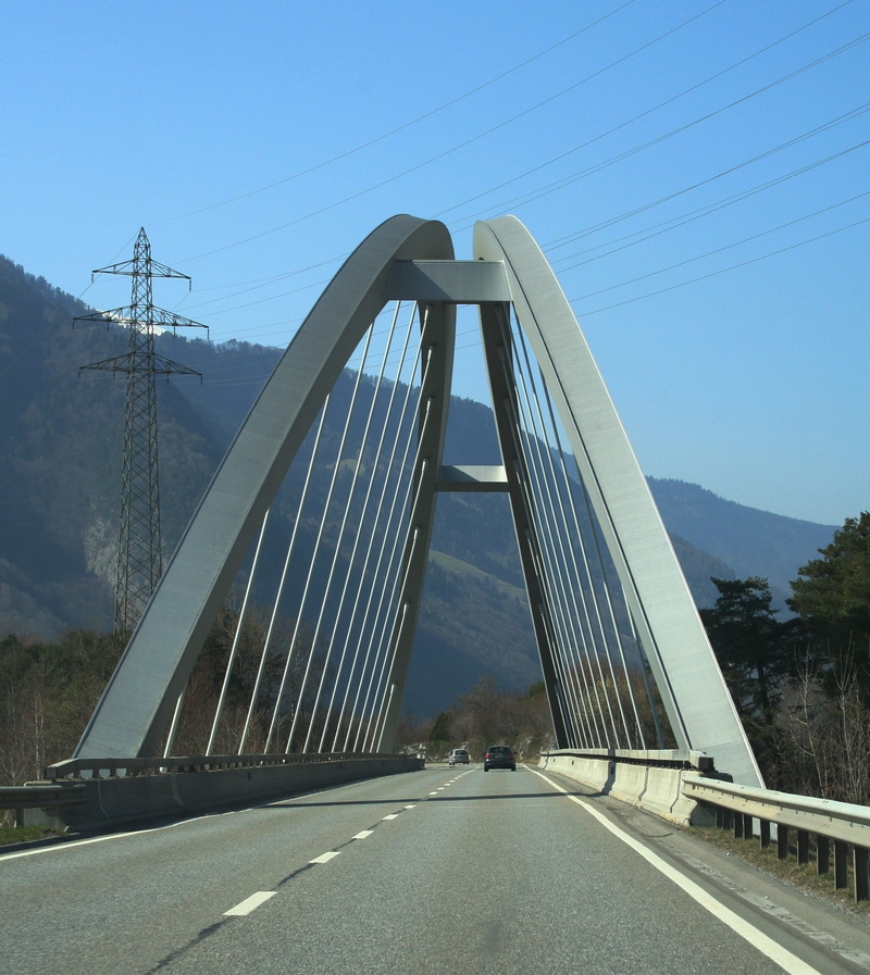 steel, engadin, clear sky, trees, road, suspension bridge, engineering, sunlight, cable, steel cables, direction, 1080P, diminishing perspective, sun