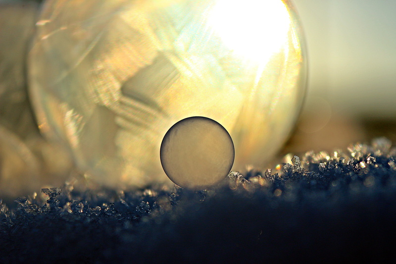 frozen bubble, geometric shape, freshness, ball, ice, winter, galaxy, indoors, macro, sphere, soap bubble, nature, circle, grass, cold, ice-bag, day, beauty in nature