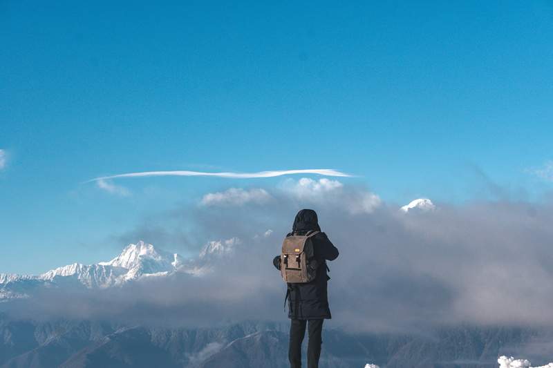day, facing, adventure, peak, mountain, three quarter length, human, standing, person, outdoors, leisure activity, cumulus, communication, snow, beauty in nature