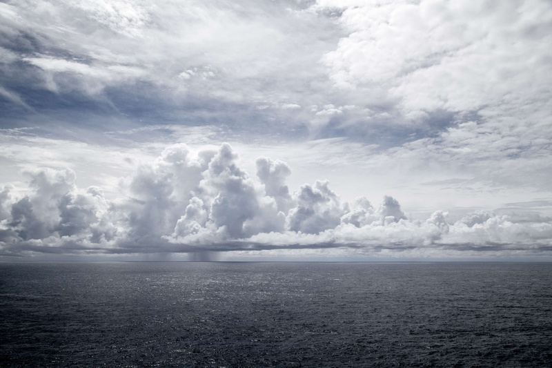 beauty in nature, tranquility, ocean, nature, rain, horizon, ominous, idyllic, environment, no people, horizon over water, clouds, scenics - nature, cloud - sky