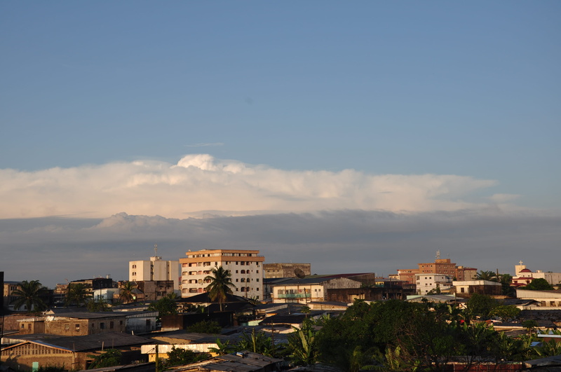 sunlight, nature, high angle view, cameroon, plant, apartment, building, architecture, day, sky, built structure, douala, city, cloud - sky, landscape