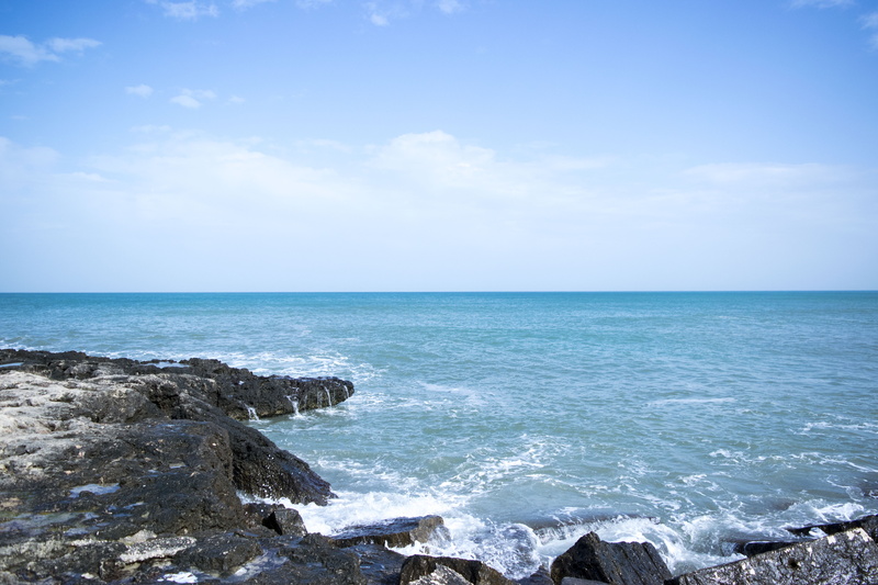 seascape, beauty in nature, beach, formation, rock, horizon, horizon over water, ocean, scenic, power in nature, coast, daytime, sea water, wave, blue