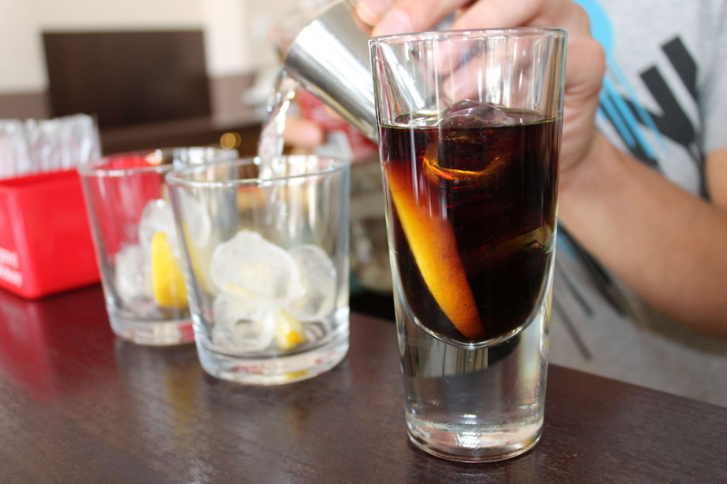 human hand, glass, indoors, bar, 4K, drink, table, barman, adult, close-up, cocktail, midsection, focus on foreground, food, one person, holding, pitcher - jug