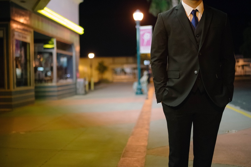 focus on foreground, suit, sidewalk, city, person, piece, business, professional, jacket, urban, set, career, style, front view, standing, street, adult