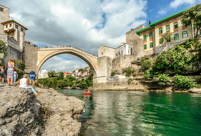 group of people, landscape, arch, building exterior, arch bridge, shore, architecture, bridge, city, neretva, europe, rocky, day, mostar, nature, tourists
