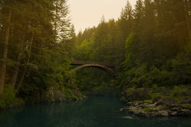 built structure, brown, daytime, cliff, bridge, arch, flowing water, bridge - man made structure, tranquility, sun, waterfront, no people, jumping, nature