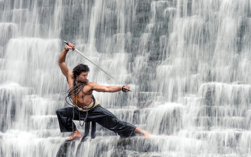 human body part, motion, waterfall, outdoors, flowing water, males, sport, young adult, guy, activity, adult, spray, 720P, water, sword, pants, limb, tropical Climate