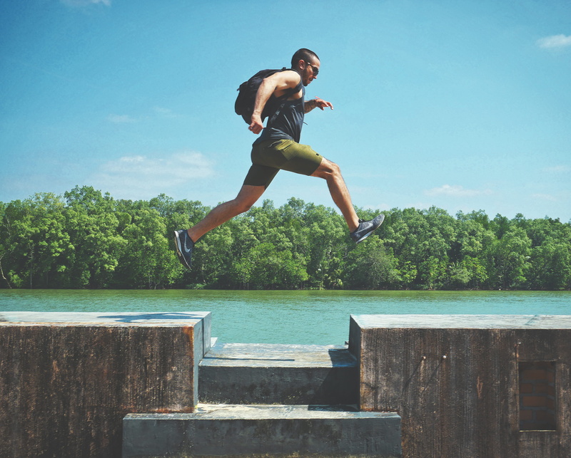 teenager, jump, young men, enjoyment, forest, sky, real people, man, shorts, person, side view, lifestyles, leaping, body, jumping, plant, leisure activity