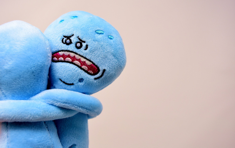 creativity, blue, hug, cute, studio shot, soft toy, colored background, close-up, human hand, sad, art and craft, mood, good bye, human body part, face