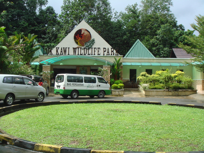 green color, western script, park, Sabah, mode of transportation, built structure, transportation, grass, day, Malaysia, 2K, rehabilitation, travel, zoo