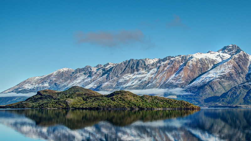 mountain range, beauty in nature, blue sky, daytime, lake, wakatipu, snow, morning, pigeon island, outdoors, formation, water, mount scenery, cold temperature