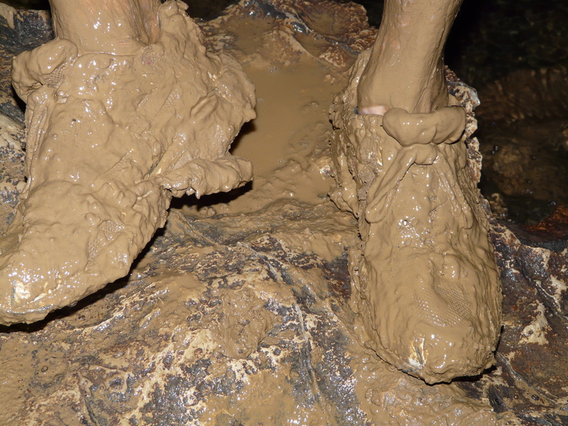 cavers, one person, body part, human body part, messy, close-up, indoors, cave, speleology, real people, low section, mud, clay, high angle view, shoes