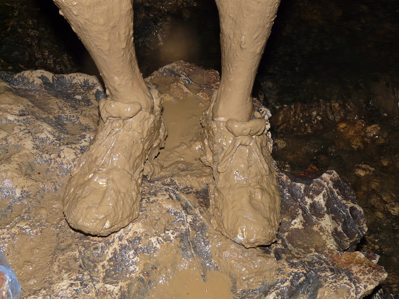 real people, cave, dirty, one person, land, speleology, outdoors, adult, wet, 2K, clay, nature, mud, limb, body part, day, human leg, human body part