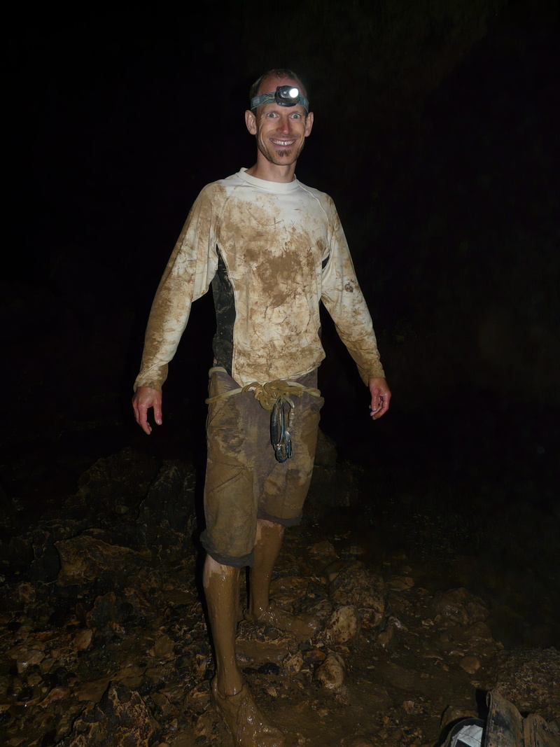 Clay, cavity, loamy, darkness, real people, Speleology, hall, Dirt, space, adults only, people, standing, dark, looking at camera, fashion, black background