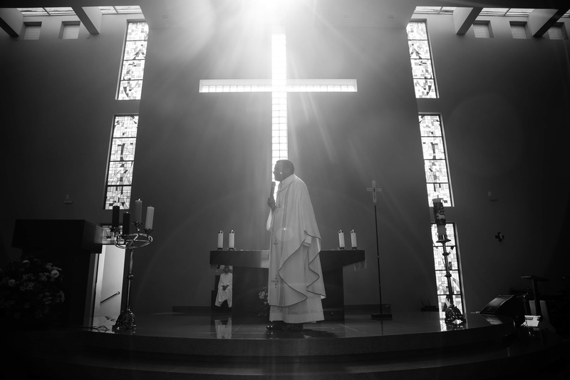 black and white, communication, black-and-white, musician, artist, clothing, occupation, standing, podium, men, building, priest, person, built structure
