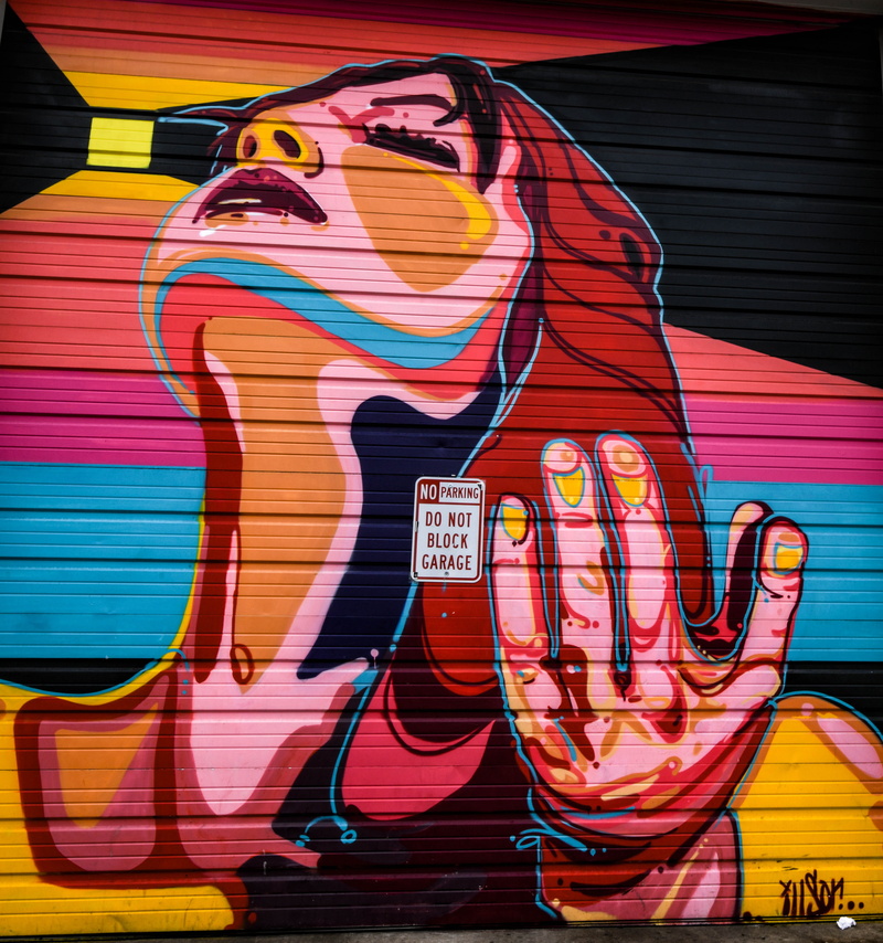 architecture, indoors, street art, day, couch, interior design, stage, wall, human representation, multi colored, room, pattern, female likeness, furniture