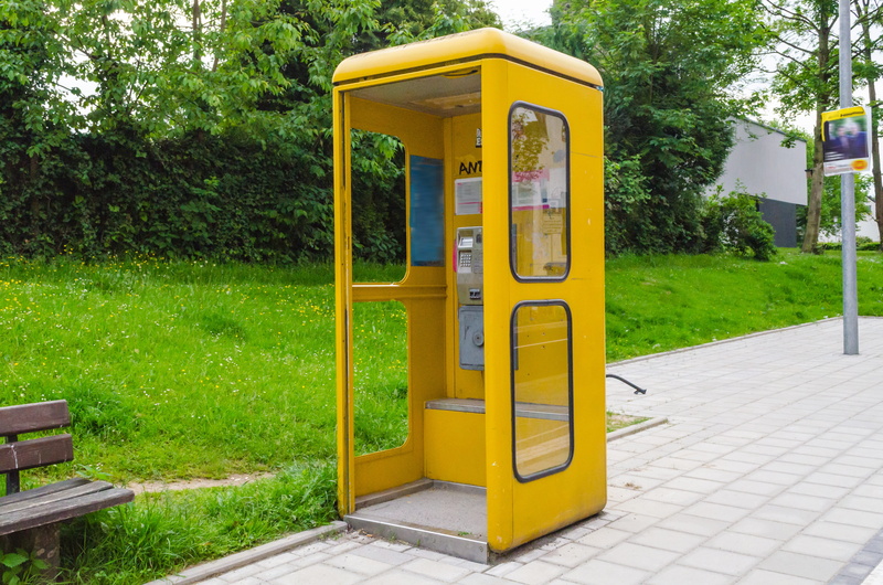 old, dispensary, grass, park - man made space, footpath, pay phone, tree, across, outdoors, park, green, nature, post, emergency, telephone, phone, day