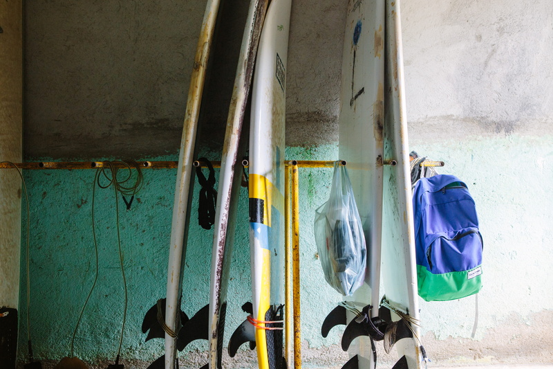 hygiene, choice, backpack, 5K, mop, still life, in a row, nicaragua, cleaning equipment, built structure, day, equipment, broom, hanging, surfboard, pipe - tube