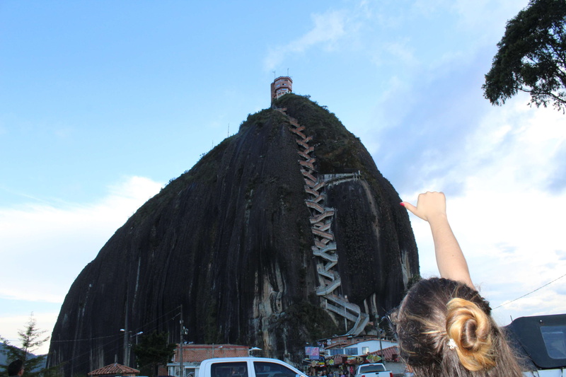 day, building exterior, outdoors, lifestyles, cool, arms raised, women, girl, guatape, sky, hair, architecture, stairs, headshot, adult, monolito, cloud - sky