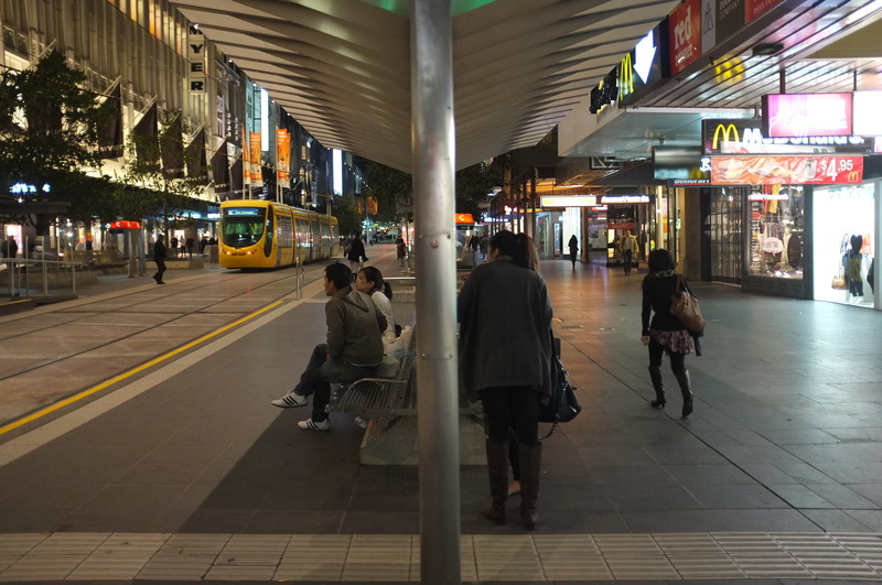 real people, land vehicle, mall, adult, lifestyles, city life, illuminated, australia, 4K, downtown, men, public transportation, outdoors, women, group of people