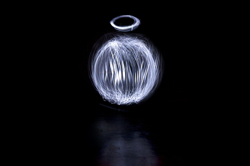 copy space, lighting equipment, motion, composition, black background, wire wool, illuminated, spinning, beautiful, no people, light coloring, divine, background
