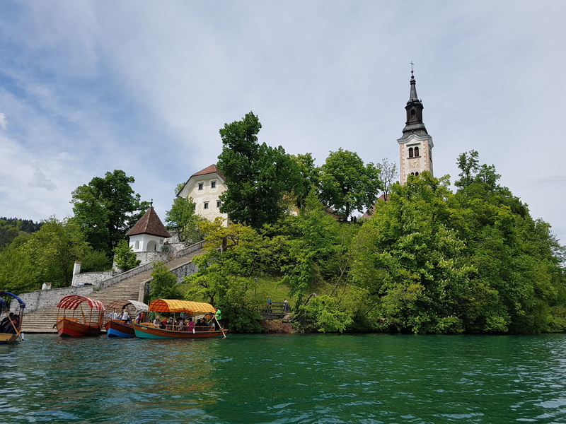 times, transportation, architecture, cloud - sky, castle, slovenia, sky, travel destinations, cathedral, water, mode of transportation, day, nature, plant