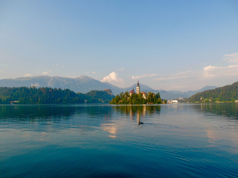 waterfront, island, bled, mountain range, promontory, beach, lagoon, day, 4K, mountain, ocean, water, lake, church, outdoors, vegetation, tranquil scene