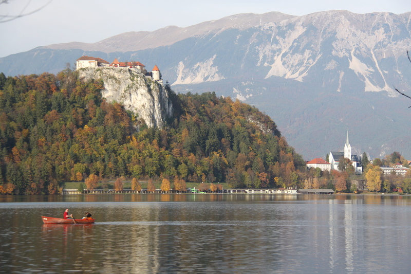 body of water, built structure, lake, beauty in nature, day, architecture, outdoors, nature, plant, mountain range, waterfront, tranquility, water, panoramic image