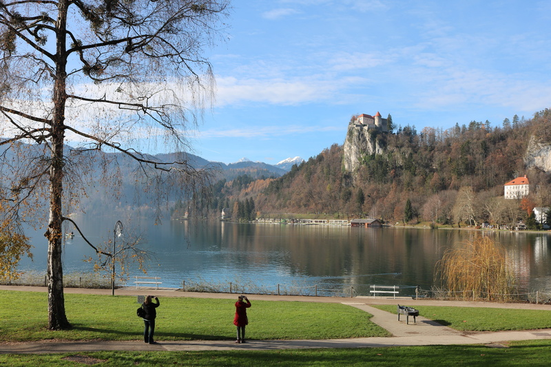 mountain, blue, bled, beauty in nature, water, reflections, travel, outdoors, tranquil scene, plant, landscape, 5K, real people, lifestyles, tourism, boat