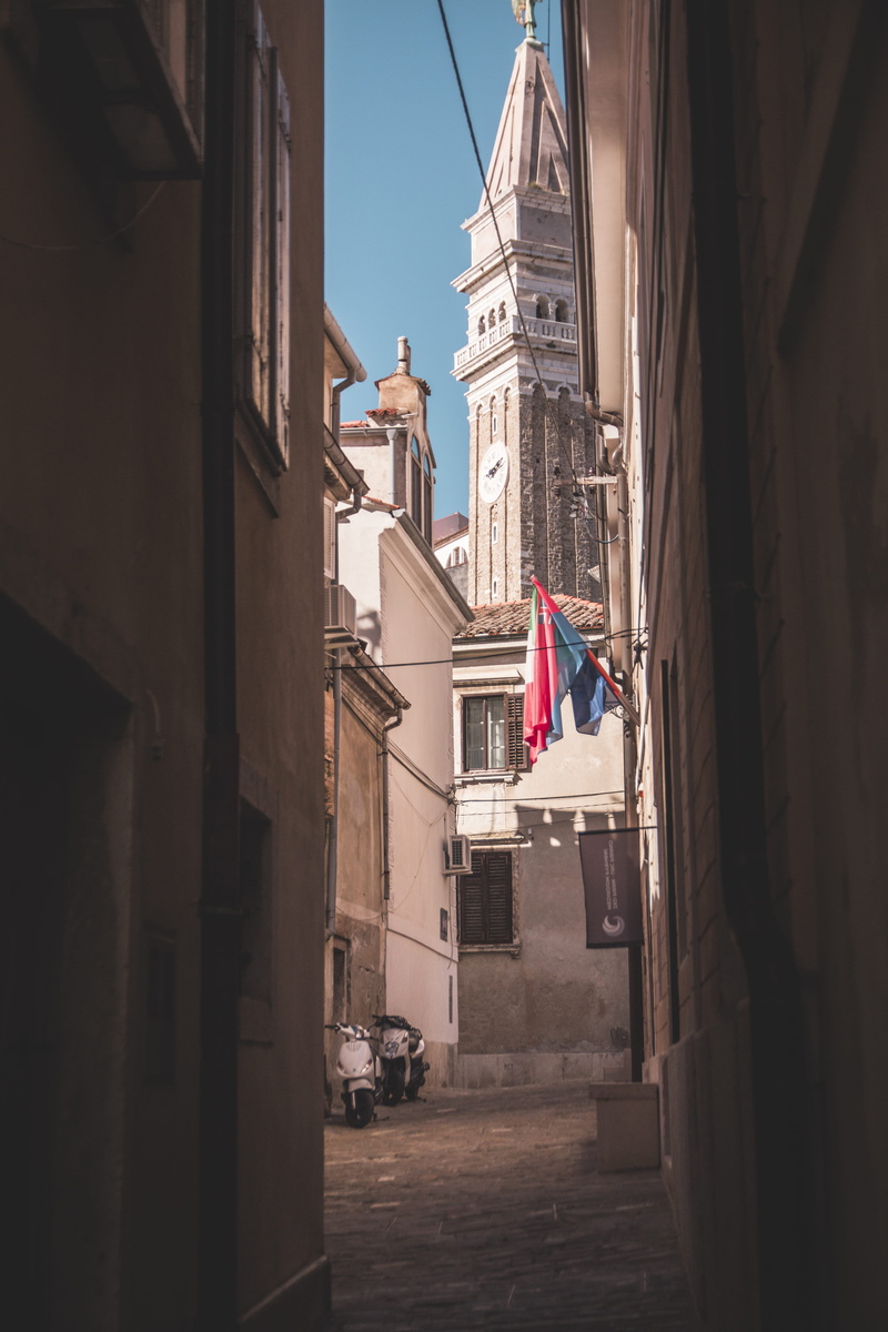 direction, 5K, outdoors, street, flag, motor vehicle, no people, transportation, building, sky, architecture, land vehicle, national icon, patriotism