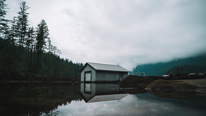 building exterior, boat, tranquility, beauty in nature, near, architecture, outdoors, house, fog, scenics - nature, day, cloud - sky, built structure, shed
