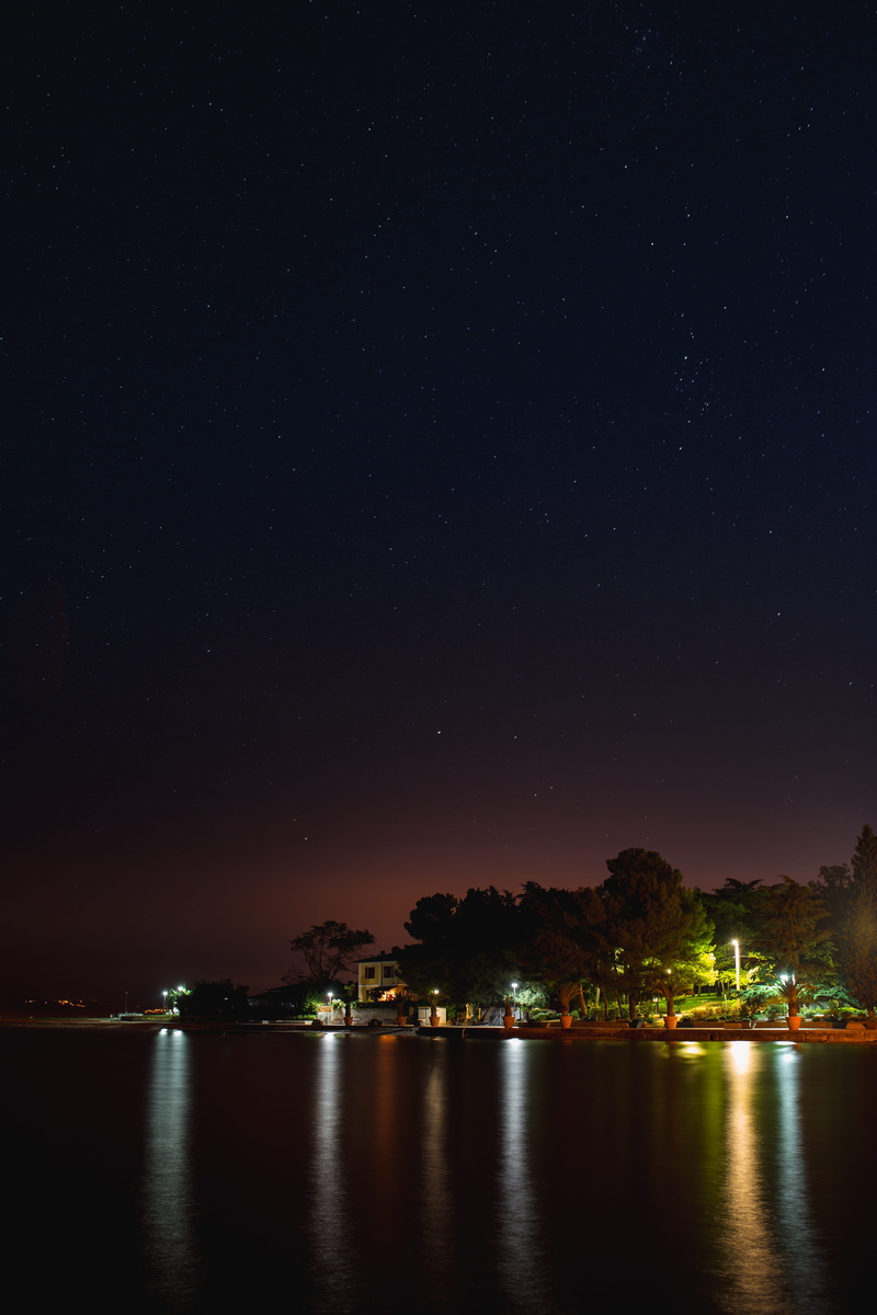 nature, night, no people, night lights, space and astronomy, building exterior, waterfront, waterscape, outdoors, star - space, water, marina, slovenia