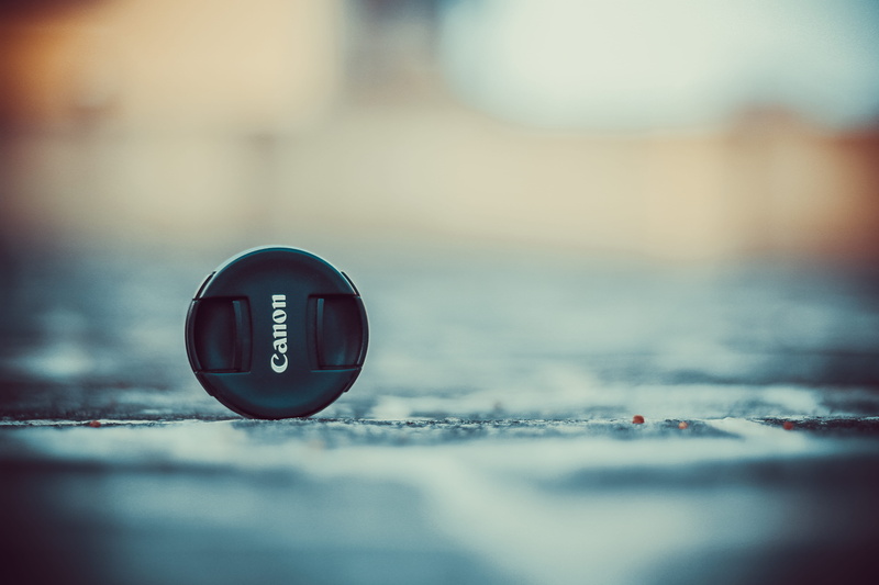 surface level, table, shape, eos, no people, dop, 5K, dslr, metal, outdoors, city, architecture, textured, nature, circle, cap, single object, 550d, close-up