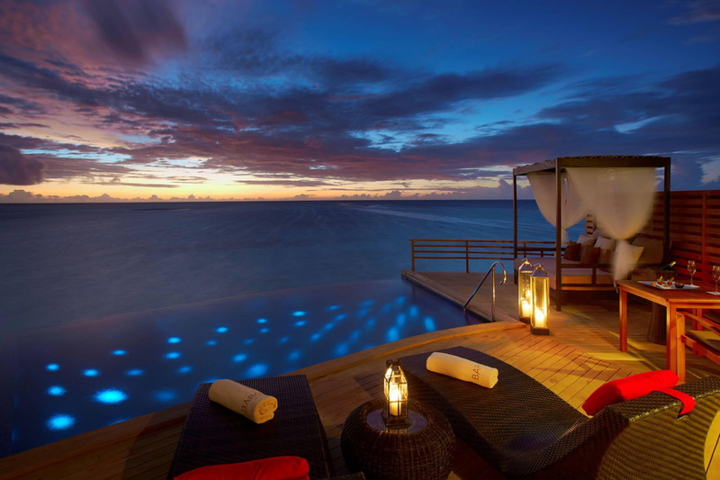 tourist resort, cloud - sky, water, no people, architecture, table, illuminated, sunset, candle, sky, sea, black, beauty in nature, electric lamp, glass
