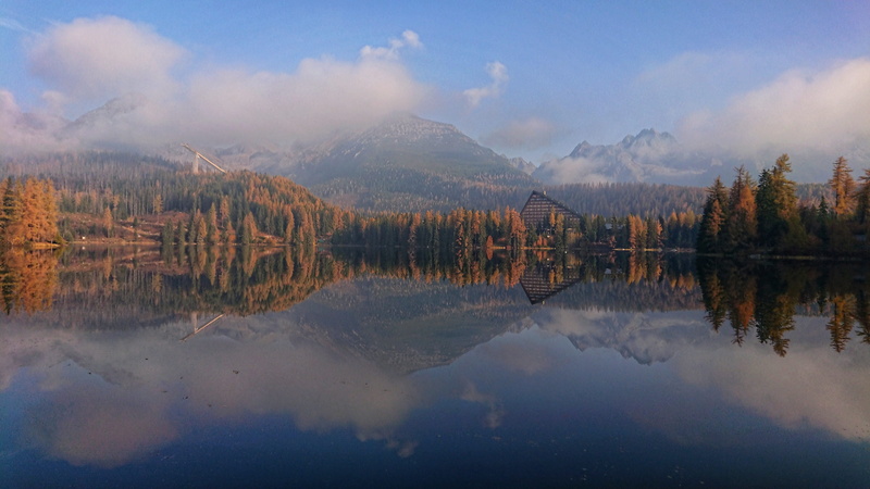 the sky, slovakia, štrbské, tranquil scene, symmetry, bridge, rocks, lake, reflection, pleso, outdoors, high, hotel, plant, standing water, beauty in nature
