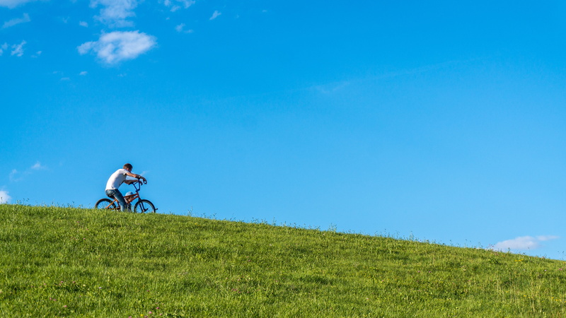 bike, sky, moscow, men, bicycle, cycling, grass, day, one person, minimal, lifestyles, plant, blue, uphill, outdoors, boy, green color, hill, land, transportation
