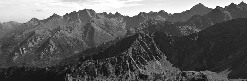 eroded, solid, rock - object, land, tops, environment, beauty in nature, mountain peak, mountain, outdoors, mountain ridge, non-urban scene, nature, cloud - sky