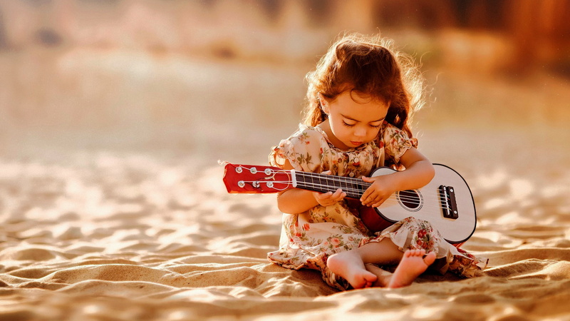 innocence, fun, sand, photography, offspring, child, beach, sunlight, music, full length, childhood, musical instrument, children, sitting, 2K, land, enjoyment