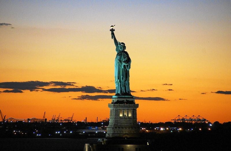 travel destinations, sunset, tourism, architecture, orange color, illuminated, united states, cloud - sky, staten iceland, dom, statue, art and craft, built structure