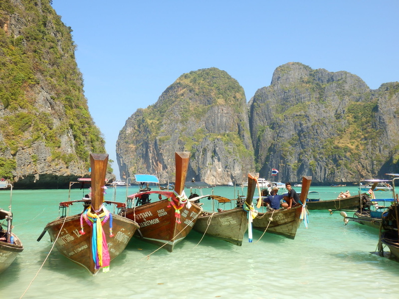 no people, tranquility, beauty in nature, moored, ile, clear sky, koh phi phi, rocks, boats, longtail boat, outdoors, thailand, mountain, nautical vessel