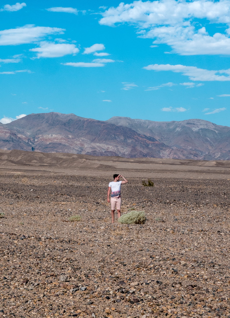 land, full length, desert, environment, mountain range, travel, one person, mountain, furnace creek, united states, boy, look, death valley, cloud - sky