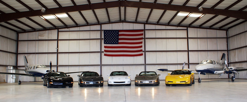 hanger, jet, cars, chevy, illuminated, airplane, automobile, car, architecture, patriotism, business, indoors, 4th of july, corvette, city, vette, independence