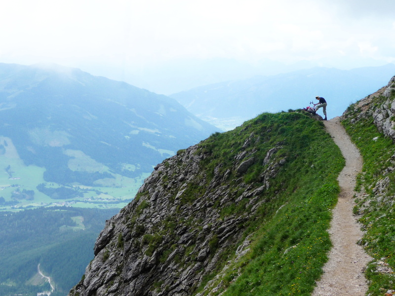 sky, non-urban scene, activity, alpine, one person, leisure activity, mountain range, tranquil scene, environment, sidewalk, real people, mountain, idyllic