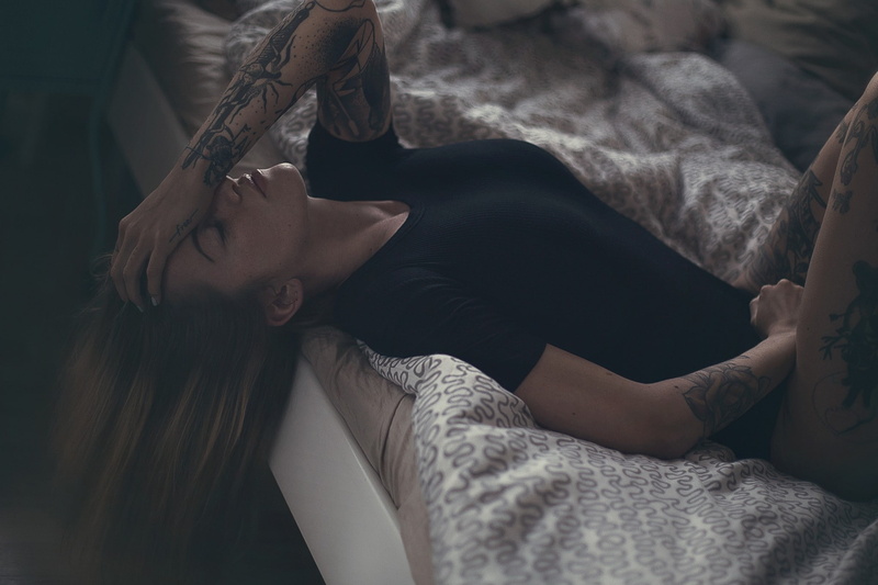 Matthias Binner, women, in bed, blonde, closed eyes, tattoo, lying on back, black clothing, 1080P, legs up