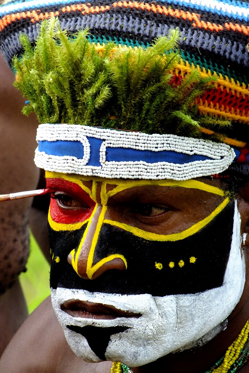 real people, one person, adult, body part, painted, african, celebration, face paint, human body part, human face, looking at camera, front view, mask