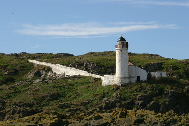 low angle view, lighthouse, nature, building, guidance, mountain, isle of may, seashore, no people, tower, plant, history, architecture, tourism, travel